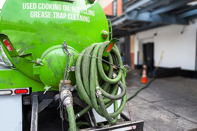 pump truck removing waste from a grease trap in Beverly Hills, MI